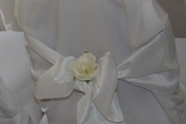Flower in chair cover sash